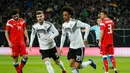 Gelandang timnas Jerman Leroy Sane mencetak gol pembuka timnas Jerman pada laga persahabatan kontra Rusia di Stadion Red Bull Arena, Leipzig. Timnas Jerman menang 3-0. (AFP/Odd Andersen)