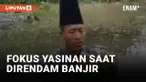 Viral! Pria Baca Surat Yasin saat Direndam Banjir Gresik
