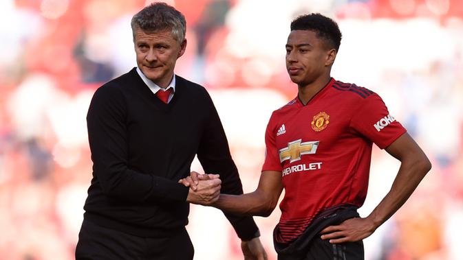 Ole Gunnar Solskjaer bersama Jesse Lingard. (AFP/Oli Scarff)