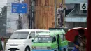 Kendaraan melintas di sekitar Patung Kapten Tubagus Muslihat, Simpang Jalan Kapten Muslihat, Kota Bogor, Jawa Barat, Senin (26/12/2022). Patung hasil karya seniman Yayat Darajat ini merekonstruksi wajah, tubuh dan perawakan pahlawan yang gugur di medan perang usai tertembak di Jembatan Merah. (Liputan6.com/Magang/Aida Nuralifa)