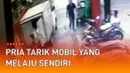 CCTV merekam momen heroik seorang pria di belakang mobil boks. Ketika pria itu hendak mengangkut barang, mobil boks tiba-tiba bergerak sendiri. Pria berbaju merah itu langsung berusaha menahan laju mobil di jalan menurun.