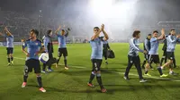 Luis Suarez rekan-rekannya membawa Uruguay bertengger pada peringkat kedua klasemen zona CONMEBOL dan lolos ke putaran final Piala Dunia 2018 dengan koleksi 31poin dari sembilan kali menang. (AFP/Pablo Porciuncula)