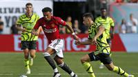 Aksi Jadon Sancho saat mencetak gol untuk Manchester United. Kecepatannya membuat dia mampu menaklukkan bek Arsenal di tur pramusim yang berkesudahan dengan skor 2-0 untuk MU (AFP)