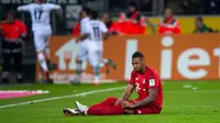 Ekspresi bek Bayern Munchen, Jerome Boateng, saat laga kontra Borussia Moenchengladbach, beberapa waktu lalu di Borussia Park. Boateng diprediksi kembali bugar pada medio April 2016. (EPA/Guido Kirchner)