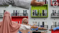 Pasien orang tanpa gejala (OTG) Covid-19 mengikuti senam pagi bersama tenaga medis dari atas balkon di Rumah Singgah Karantina Covid-19 Kabupaten Tangerang, Selasa (26/5/2020). Sebanyak 40 OTG hasil rapid test dan swab test positif menjalani di rumah singgah tersebut. (Liputan6.com/Fery Pradolo)
