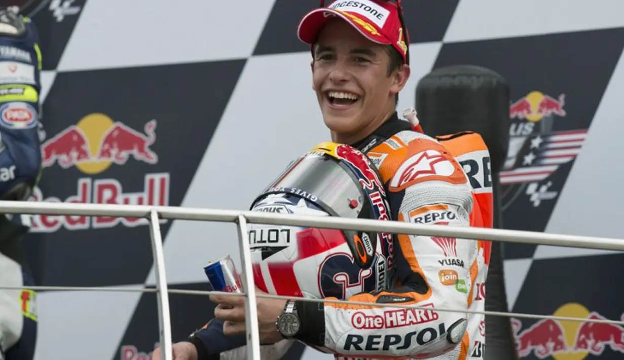 Kemenangan kesepuluh secara beruntun Marc Marquez di ajang MotoGP 2014 menyamai rekor yang pernah ditoreh Giacomo Agostini pada 1970 dan Mick Doohan (1997), (10/8/2014). (Getty Images/AFP)