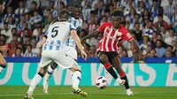 Pemain Athletic Bilbao, Nico Williams (kanan) masih kesulitan mencapai kesepakatan kontrak baru dengan klubnya. Jika kesepakatan baru tidak ditandatangani, ada kemungkinan Williams akan hengkang pada bulan Januari 2024. Athletic tentu tidak ingin kehilangan pemain berusia 21 tahun itu secara gratis di musim panas. (AFP/Cesar Manso)