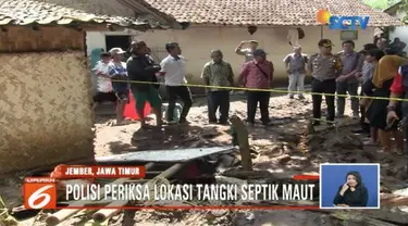 Polisi dan tim medis periksa septic tank yang merenggut nyawa satu keluarga di Jember, Jawa Timur.