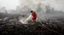 Sebelumnya, kebakaran hutan dan lahan di kawasan Rimbo Panjang, Kabupaten Kampar, Riau terjadi sejak Sabtu 13 Juli 2025. (Wahyudi/AFP)