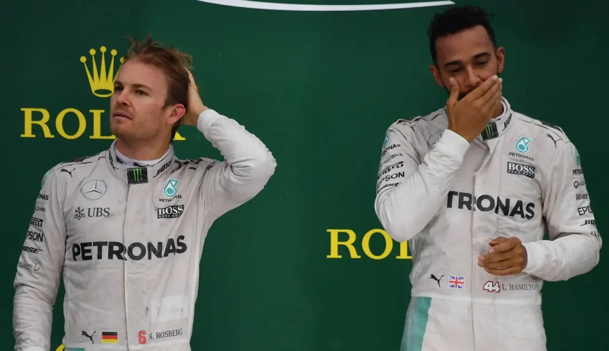 F1 2016 menjadi arena pertarungan sengit duo Mercedes, Nico Rosberg dan Lewis Hamilton. Seri terakhir, GP Abu Dhabi, yang akan dihelat 27 November 2016 akan menjadi ajang penentuan gelar juara dunia. (AFP/Nelson Almeida)
