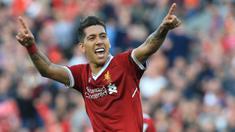 Pemain Liverpool, Roberto Firmino merayakan golnya ke gawang AFC Bournemouth pada lanjutan Premier League di Anfield stadium, Liverpool,(14/4/2018). Liverpool menang 3-0.  (AFP/Lindsey Parnaby)