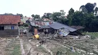 Banjir bandang di Bogor telah menghanyutkan rumah dan menewaskan satu orang. (Liputan6.com/Achmad Sudarno)