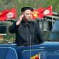 Pemimpin Korea Utara, Kim Jong-un saat memantau pasukan jelang upacara untuk peringatan 85 tahun pembentukan Tentara Rakyat Korea (KPA) di Korea Utara (26/4). (AFP FOTO / KCNA / STR)