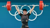 Keberhasilan Rizki Juniansyah meraih medali emas di Olimpiade 2024 bisa dibilang spektakuler. Tak sembarang atlet bisa melakukannya. Bayangkan saja, Rizki langsung merebut medali emas pada penampilan debutnya di Olimpiade. (AFP/Miguel Medina)