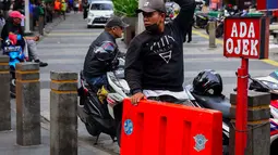 Menteri Usaha Mikro Kecil dan Menengah (UMKM) Maman Abdurrahman mengungkap bahwa Kementerian UMKM sedang menyiapkan skema strategi untuk mengakomodasi kebutuhan pengemudi ojek pangkalan. (Liputan6.com/Angga Yuniar)