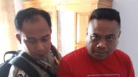 ASJ alias Rili alias Renal (34), ditangkap polisi karena melakukan penipuan modus menggandakan uang (Arfandi Ibrahim/Liputan6.com)