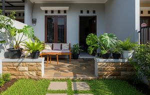 Desain Teras Sederhana Area Hijau untuk Rumah Dengan Material Alami dan Pot Tanaman/ AI