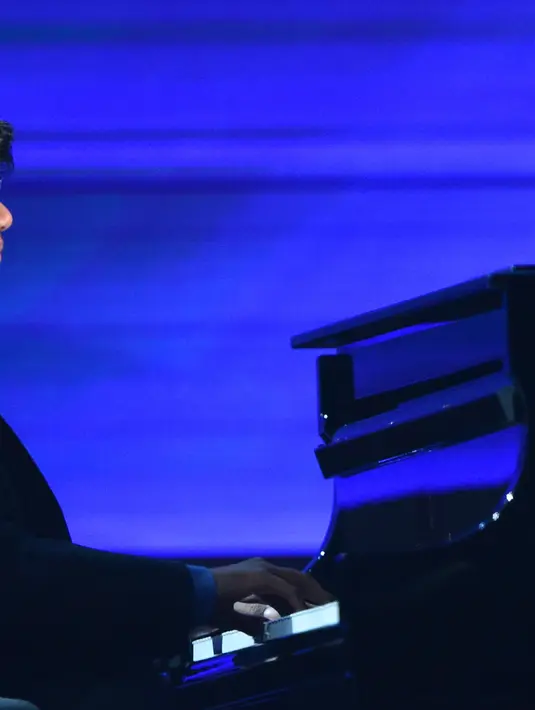 Berhasil menembus Grammy Awards 2016, netizen antusias untuk mendukung Joey Alexander. Prestasinya yang mengharumkan nama bangsa ini membawa aura positif bagi kemajuan musik Indonesia. (AFP/Bintang.com)