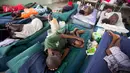 Para tahanan yang sakit, beristirahat di rumah sakit di Lembaga Pemasyarakatan Nasional di pusat kota Port-au-Prince, Haiti, (13/2). Penuhnya Lapas ini membuat narapidana mengalami berbagai penyakit dan gizi buruk. (AP Photo/Dieu Nalio Chery)