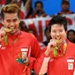 Ganda campuran Indonesia, Tontowi Ahmad/Liliyana Natsir, merebut medali emas Olimpiade Rio de Janeiro 2016 setelah mengalahkan pasangan Malaysia, Chan Peng Soon/Goh Liu Ying, pada partai final di Riocentrio, Rabu (17/8/2016) WIB. (AFP/Goh Chai Hin)