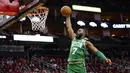 Pebasket Boston Celtics, Jaylen Brown, berusaha memasukkan bola saat melawan Houston Rockets pada laga NBA Rabu (12/2/2020). Houston Rockets menang 116-105 atas Boston Celtics. (AP/David J. Phillip)