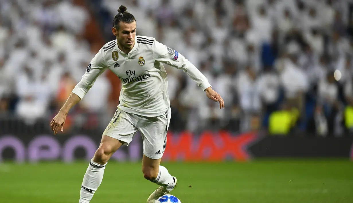 1. Gareth Bale - Sepeninggal Ronaldo, otomatis Real Madrid bergantung kepada Bale di sektor lini depan. Terbukti 11 laga sudah dilakoni pemain timnas Wales tersebut. (AFP/Joe Klamar)