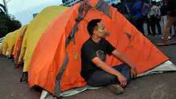 Aksi massa yang tergabung dalam Gerakan Rakyat Peduli Pilkada Langsung (Gerpala) itu untuk menolak pengesahan RUU pilkada melalui DPRD, Jakarta, (23/9/14). (Liputan6.com/Miftahul Hayat)