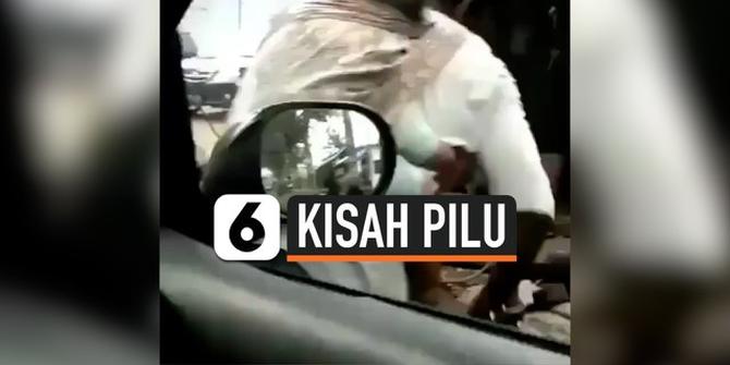 VIDEO: Viral, Tukang Tambal Ban Asuh Anak sambil Kerja