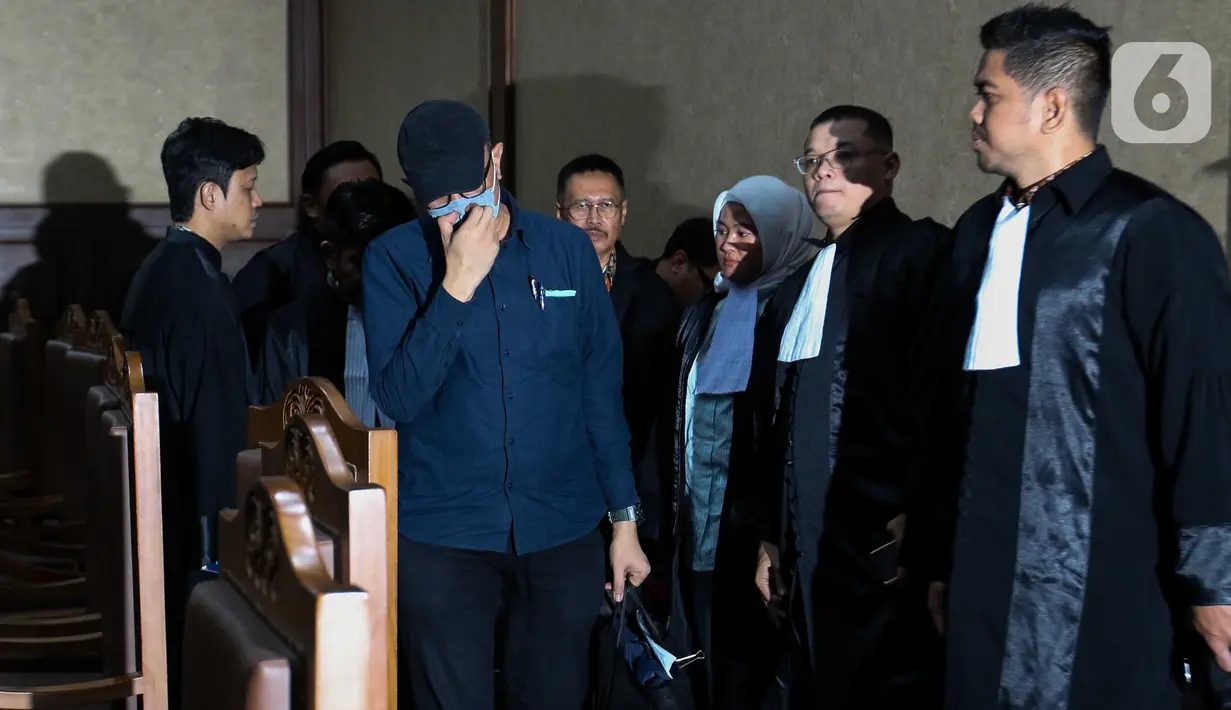 Terdakwa kasus suap vonis bebas Gregorius Ronald Tannur, Heru Hanindyo usai mengikuti sidang pembacaan putusan di Pengadilan Tindak Pidana Korupsi (Tipikor), Jakarta, Kamis (8/5/2025). (Liputan6.com/Herman Zakharia)