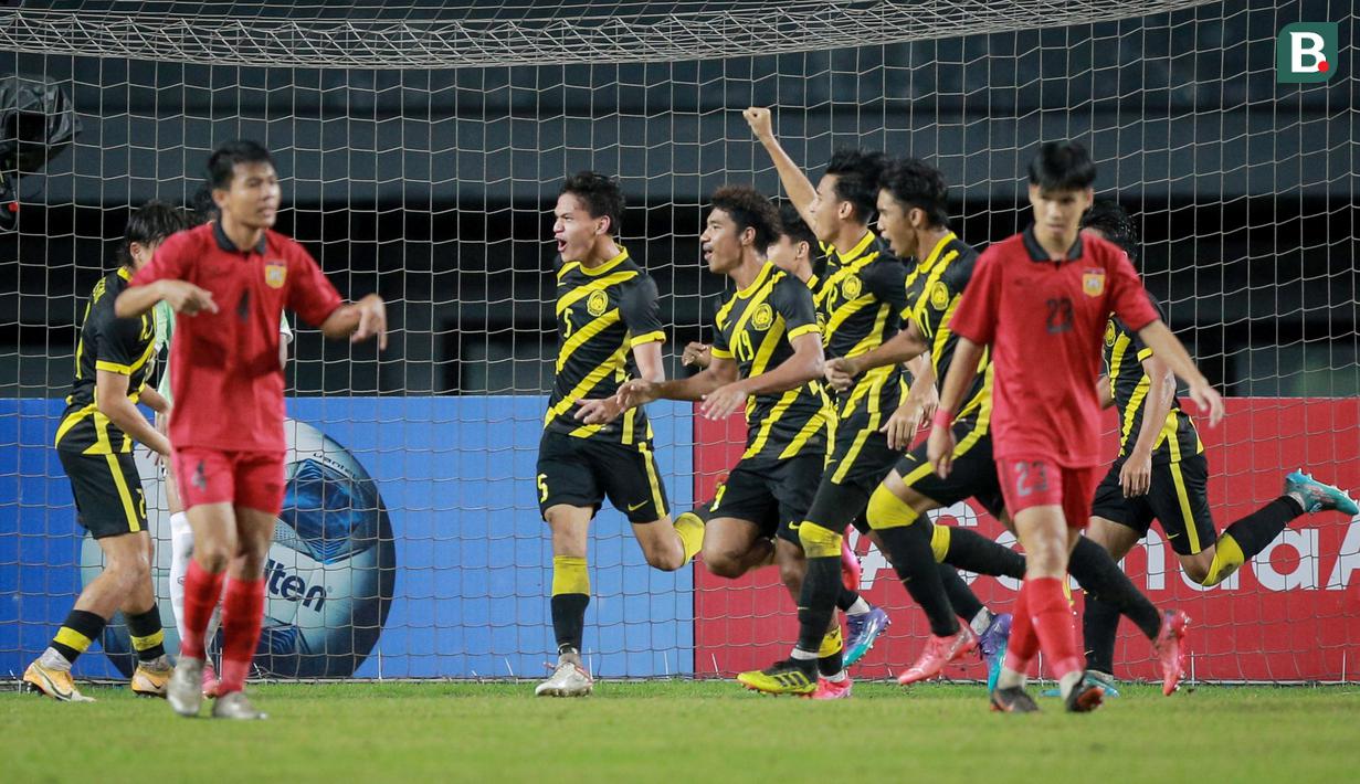 <p>Pemain Timnas Malaysia U-19 merayakan gol yang dicetak oleh Muhammad Faiz ke gawang Timnas Laos U-19 pada laga final Piala AFF U-19 2022 di Stadion Patriot Chandrabhaga, Bekasi, Jumat (15/7/2022). (Bola.com/Bagaskara Lazuardi)</p>