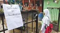 Madrasah Ibtidaiyah Nurul Islam, Kelurahan Grogol, Kecamatan Limo, Kota Depok, banjir akibat luapan Kali Krukut (Liputan6.com/Dicky Agung Prihanto)