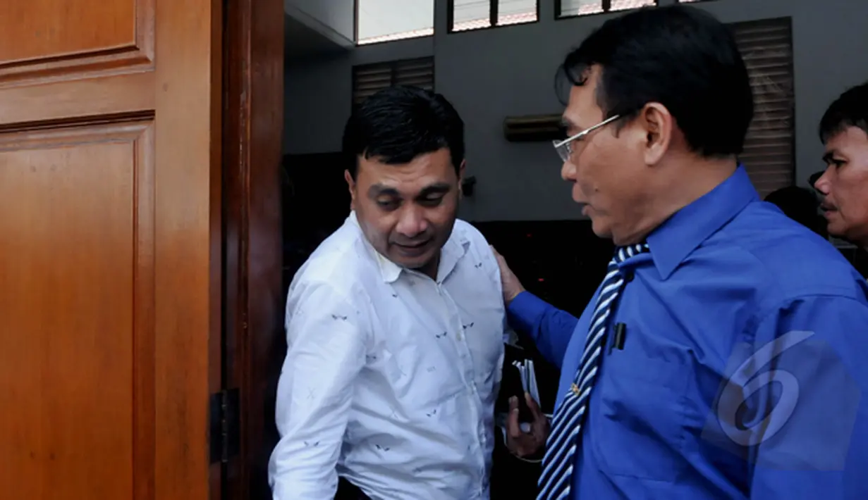 AKBP Irsan saat mendatangi ruang sidang. Ia menjadi saksi dalam sidang lanjutan Praperadilan Budi Gunawan di Pengadilan Negeri Jakarta Selatan, Selasa (10/2/2015). (Liputan6.com/Johan Tallo)