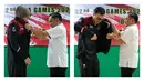 Foto kolase Kapten Timnas Voli Putri Indonesia, Wilda Siti Nurfadilah Sugandi dan kapten Timnas Voli Putra Indonesia, Nizar Zulfikar saat disematkan jaket oleh Ketua Umum PP PBVSI, Imam Sudjarwo sebagai bentuk simbol pelepasan Timnas Voli Indonesia untuk SEA Games 2023 di Padepokan Voli Jenderal Polisi Kunarto, Sentul, Sabtu (29/04/2023). (Bola.com/Bagaskara Lazuardi)