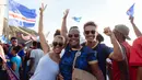 Suka cita menyelimuti rakyat Cape Verde setelah timnas mereka berhasil mencetak sejarah dengan lolos ke Piala Dunia 2026. Ini merupakan kali pertama negara kepulauan di Afrika Barat itu tampil di ajang Piala Dunia. (AFP/Queila Fernandes)