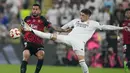 Los Blancos tampil dominan dengan mencatatkan 64,8 persen penguasaan bola, berbanding 35,2 persen milik Mallorca. El Real juga melepaskan 28 tembakan yang 11 di antaranya mengarah ke gawang. (AP Photo/Altaf Qadri)