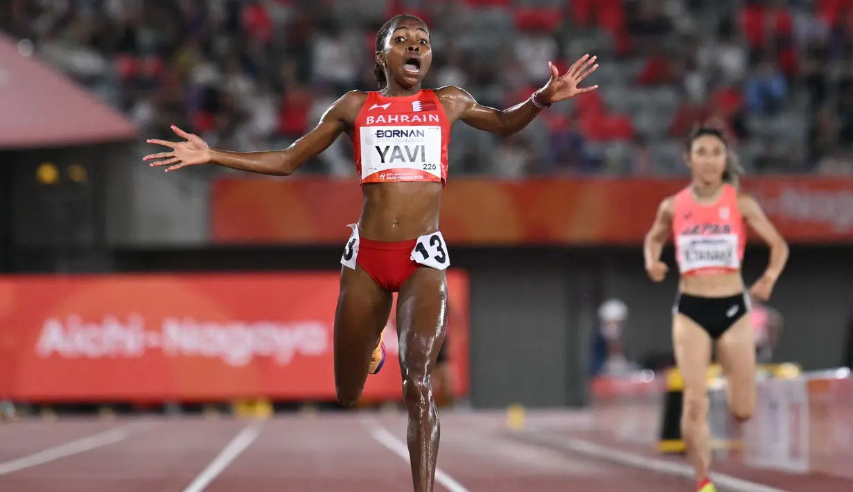 Pelari Bahrain Winfred Yavi bereaksi setelah memenangi final 10.000 meter putri pada Asian Games 2026 di Nagoya, Jepang, Kamis (24/9/2026). (MOHD RASFAN / AFP)
