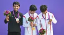 Buat Sanggoe, ini merupakan medali perak keduanya di Asian Games. Sebelumnya, ia juga meraih perak di Asian Games 2018. (Photo by Hector RETAMAL / AFP)