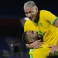 Usai melewati fase grup cabang sepak bola putra Olimpiade Tokyo 2020, telah tercipta 68 gol dari 24 laga, dengan rataan 2,83 gol tiap laga. Adalah striker Brasil, Richarlison yang sementara memimpin daftar top skor dengan membuat 5 gol. Berikut daftar lengkapnya. (Foto: AP/Kiichiro Sato)