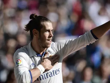 Bintang Real Madrid, Gareth Bale merayakan golnya ke gawang Leganes pada lanjutan La Liga Spanyol 2016-2017 di Santiago Bernabeu stadium, Madrid, (6/11/2016). (AFP/Javier Soriano)