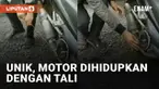 Aksi seorang pria menghidupkan motor dengan cara unik menarik perhatian