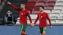 Megabintang Portugal, Cristiano Ronaldo, merayakan gol ke-6 portugal ke gawang Andorra dalam laga uji coba Internasional di Stadion Luz, Lisbon, Portugal, Kamis (12/11/2020) dini hari WIB. Portugal menang telak 7-0 atas Andorra. (AP Photo/Armando Franca)