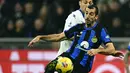 <p>Inter Milan saat ini menempati urutan pertama dengan perolehan 31 poin, unggul dua angka atas Juventus di posisi kedua. (GABRIEL BOUYS / AFP)</p>