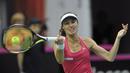 Martina Hingis saat kembali memperkuat Swis di Piala Federasi (Fed Cup) melawan Polandia di Zielona Gora, Polandia. Minggu (19/4). (AFP PHOTO/PIOTR HAWALEJ)