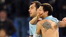 Lazio's Mauro Matias Zarate shows his tatoo as he celebrates together with Goran Pandev after scoring against Bologna during their Serie A match at Olympic stadium in Rome on February 28, 2009. AFP PHOTO/Vincenzo Pinto