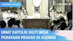 Umat Katolik mengikuti misa dalam perayaan Paskah yang digelar di Gereja St. Aloysius Gonzaga, Sleman. Dalam perayaan ini, umat Muslim turut ambil peran dengan mengatur lalu lintas hingga mengantar umat Katolik ke dalam gereja.