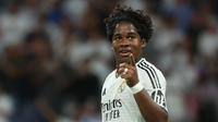 Ekspresi penyerang Real Madrid, Endrick, setelah mencetak gol ke gawang VFB Stuttgart pada matchday pertama Liga Champions 2024/2025 di Santiago Bernabeu, Rabu (18/9/2024) dini hari WIB. (Pierre-Philippe Marcou/AFP)