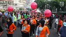 Peserta sosialisasi pelaksanaan Brimob run 2017 di Bundaran HI, Jakarta, Minggu (5/11). Brimob Run 2017 mengambil rute dari Mako Brimob di Kelapa Dua hingga Universitas Indonesia. (Liputan6.com/Angga Yuniar)