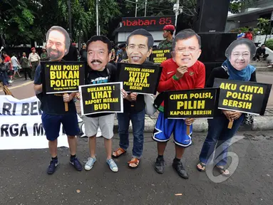 Massa dari Koalisi Untuk Reformasi Polri melakukan aksi simpatik "Pilih Kapolri Bersih" saat Car Free Day, Jakarta, Minggu (18/1/ 2015). (Liputan6.com/Miftahul Hayat)