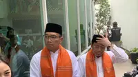 Pasangan calon gubernur dan wakil gubernur Jakarta Ridwan Kamil-Suswono berjalan kaki dari titik kumpul menuju KPU Jakarta. (Delvira Hutabarat).