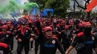 Para buruh juga mendesak pemerintah mencabut Omnibus Law Undang-Undang (UU) Cipta Kerja khususnya klaster ketenagakerjaan dan perlindungan petani. (JUNI KRISWANTO/AFP)